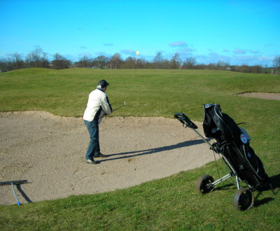 Spela golf